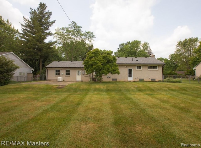 5820 Houghten Dr, Troy, MI 48098 - back of house featuring a patio area and a chimney