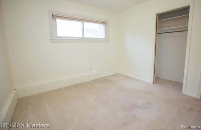 5820 Houghten Dr, Troy, MI 48098 - unfurnished bedroom featuring light carpet and a closet