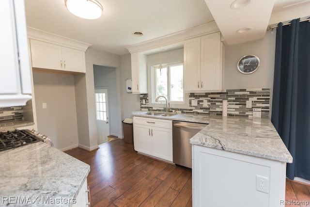 5820 Houghten Dr, Troy, MI 48098 - kitchen featuring dishwasher, a peninsula, backsplash, dark wood-style floors, and white cabinets