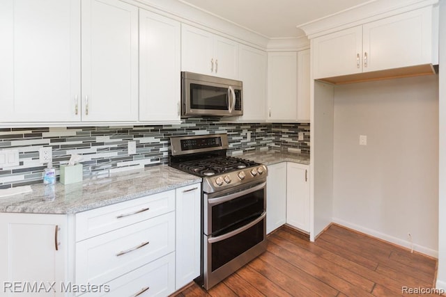 5820 Houghten Dr, Troy, MI 48098 - kitchen featuring stainless steel appliances, tasteful backsplash, dark wood-style floors, white cabinets, and light stone counters