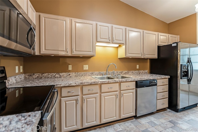 62622 Raleigh Ct Unit 4, South Lyon, MI 48178 - kitchen featuring stainless steel appliances, light countertops, and light stone finish floors