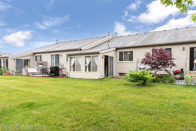 62622 Raleigh Ct Unit 4, South Lyon, MI 48178 - rear view of house with a yard