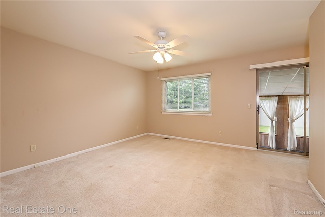 62622 Raleigh Ct Unit 4, South Lyon, MI 48178 - spare room with ceiling fan and light colored carpet