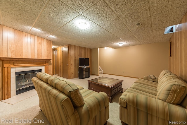 62622 Raleigh Ct Unit 4, South Lyon, MI 48178 - living area featuring carpet flooring, wood walls, and a fireplace
