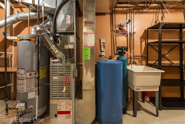 62622 Raleigh Ct Unit 4, South Lyon, MI 48178 - utility room with water heater and heating unit
