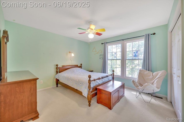 43443 Mclean Ct, Novi, MI 48375 - bedroom featuring a closet, light colored carpet, and ceiling fan