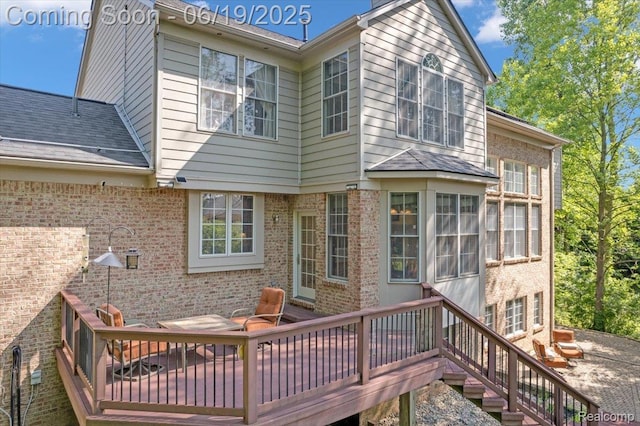 43443 Mclean Ct, Novi, MI 48375 - back of house with brick siding, a deck, and stairway