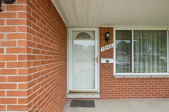 13142 Boca Grande Dr, Sterling Heights, MI 48312 - view of exterior entry featuring brick siding