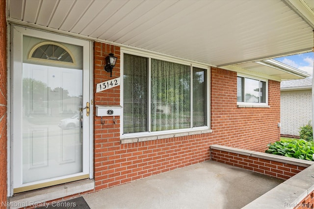 13142 Boca Grande Dr, Sterling Heights, MI 48312 - property entrance featuring brick siding and covered porch