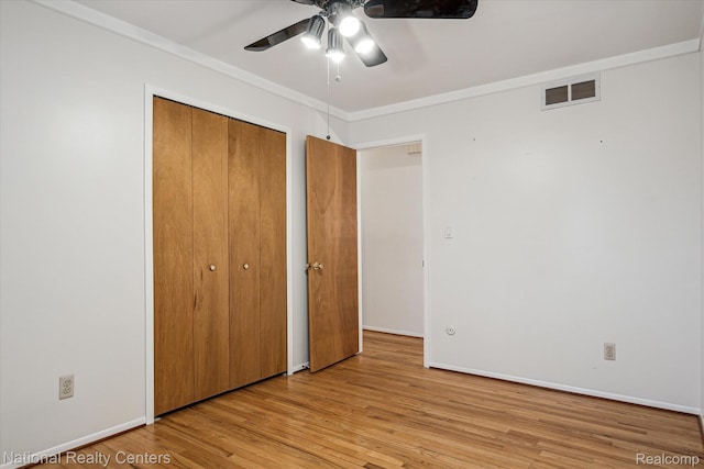 13142 Boca Grande Dr, Sterling Heights, MI 48312 - unfurnished bedroom with wood finished floors, a closet, crown molding, and ceiling fan