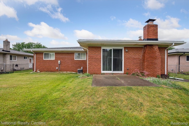 13142 Boca Grande Dr, Sterling Heights, MI 48312 - back of house with a patio area, a chimney, and brick siding