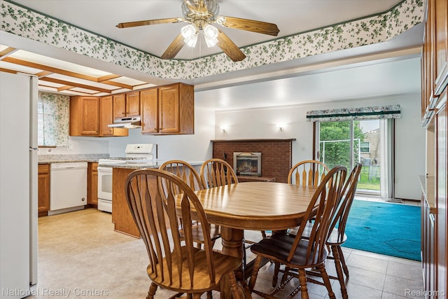 13142 Boca Grande Dr, Sterling Heights, MI 48312 - dining area featuring a fireplace, a ceiling fan, and light tile patterned flooring