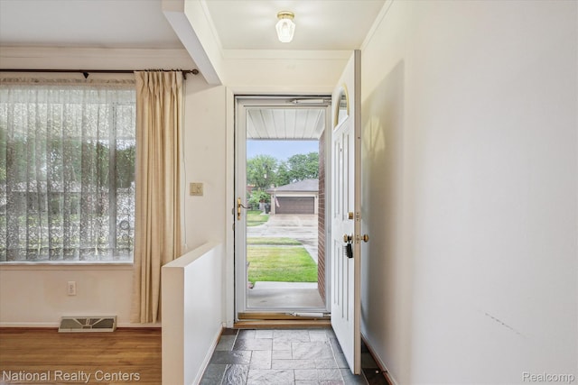 13142 Boca Grande Dr, Sterling Heights, MI 48312 - entrance foyer with healthy amount of natural light, ornamental molding, and stone tile floors