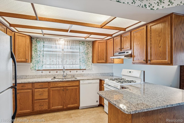 13142 Boca Grande Dr, Sterling Heights, MI 48312 - kitchen with white appliances, under cabinet range hood, brown cabinets, a peninsula, and light stone countertops
