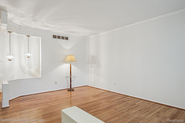 13142 Boca Grande Dr, Sterling Heights, MI 48312 - unfurnished room featuring wood finished floors and ornamental molding