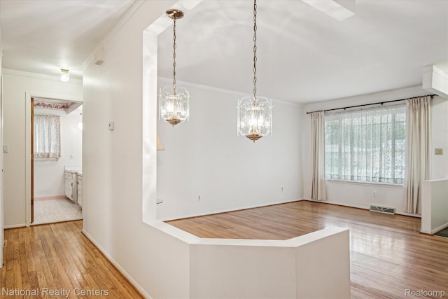 13142 Boca Grande Dr, Sterling Heights, MI 48312 - hallway featuring wood finished floors, a chandelier, and crown molding