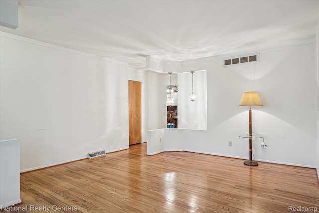 13142 Boca Grande Dr, Sterling Heights, MI 48312 - unfurnished room featuring wood finished floors and ornamental molding