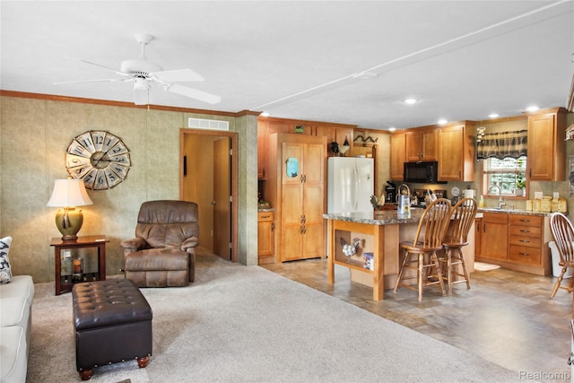 501 Kinloch, Temperance, MI 48182 - kitchen featuring black microwave, open floor plan, crown molding, a breakfast bar, and ceiling fan