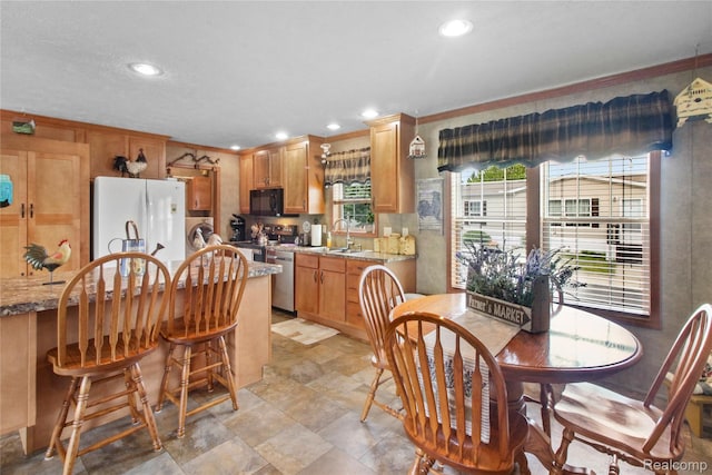 501 Kinloch, Temperance, MI 48182 - dining area with washer / dryer, recessed lighting, light stone finish flooring, and crown molding