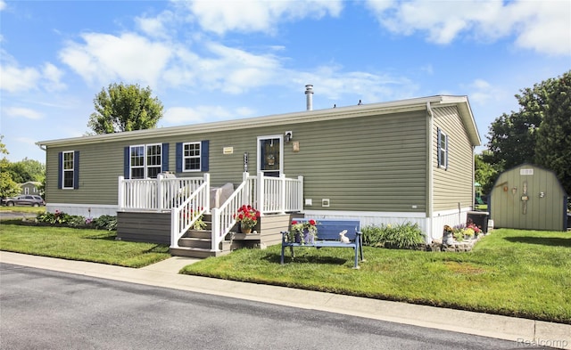 501 Kinloch, Temperance, MI 48182 - manufactured / mobile home with a shed and a front lawn
