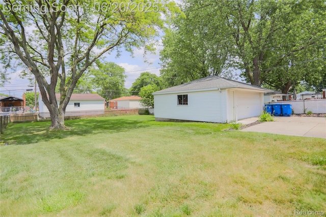 14839 Chippewa Dr, Warren, MI 48088 - view of yard featuring an outbuilding and a garage
