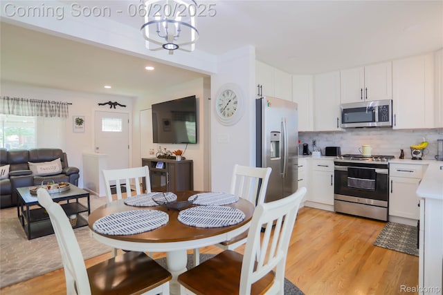 14839 Chippewa Dr, Warren, MI 48088 - dining area with a chandelier, light wood-type flooring, and recessed lighting
