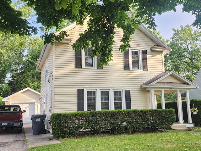 1908 Lakeway Ave, Kalamazoo, MI 49001 - view of front of property featuring an outbuilding, a detached garage, driveway, and a front lawn