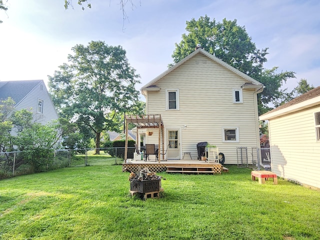 1908 Lakeway Ave, Kalamazoo, MI 49001 - back of house featuring a deck, a fenced backyard, a pergola, an outdoor fire pit, and a gate