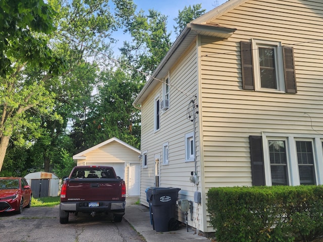 1908 Lakeway Ave, Kalamazoo, MI 49001 - view of side of home featuring an outdoor structure and a garage