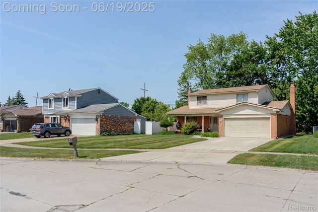 38247 Forsdale Dr, Sterling Heights, MI 48310 - traditional home featuring brick siding, a garage, a chimney, and driveway