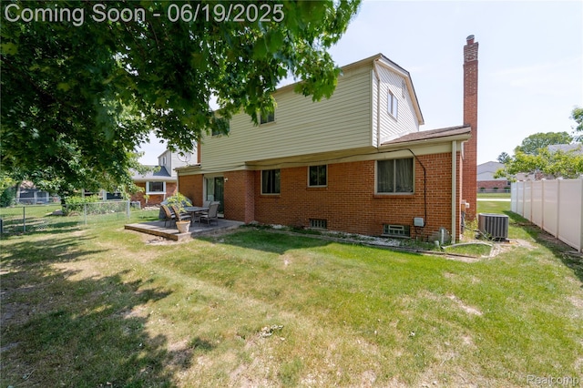 38247 Forsdale Dr, Sterling Heights, MI 48310 - rear view of property featuring a chimney, a fenced backyard, a patio, and brick siding