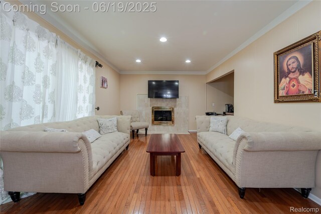 38247 Forsdale Dr, Sterling Heights, MI 48310 - living area with hardwood / wood-style floors, crown molding, a fireplace, and recessed lighting
