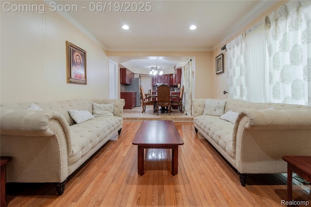 38247 Forsdale Dr, Sterling Heights, MI 48310 - living area with a chandelier, ornamental molding, and light wood-type flooring