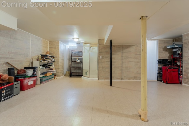 38247 Forsdale Dr, Sterling Heights, MI 48310 - finished basement featuring brick wall and tile patterned floors