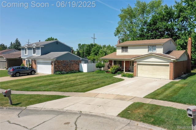 38247 Forsdale Dr, Sterling Heights, MI 48310 - traditional home with brick siding, a garage, a chimney, and driveway