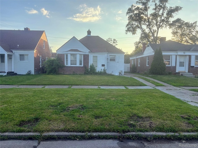18411 Asbury Park, Detroit, MI 48235 - bungalow-style house featuring brick siding and a front lawn