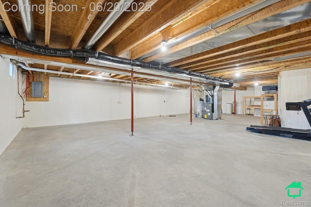 4273 Fairway Ln, Jackson, MI 49201 - unfinished basement with electric panel, gas water heater, and heating unit