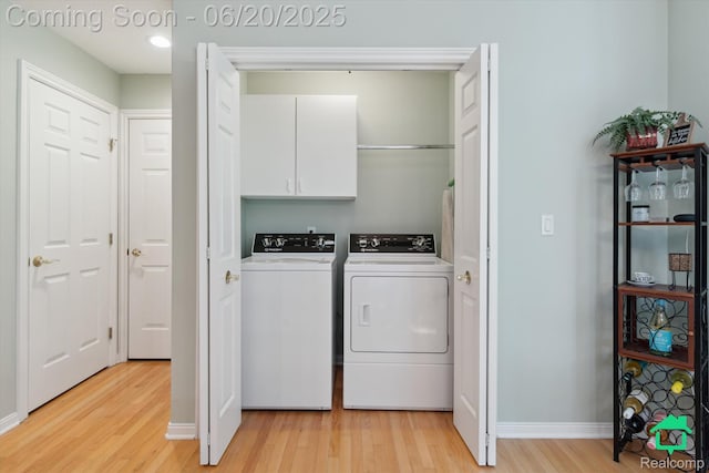 4273 Fairway Ln, Jackson, MI 49201 - washroom with cabinet space, washing machine and dryer, light wood-style floors, and recessed lighting
