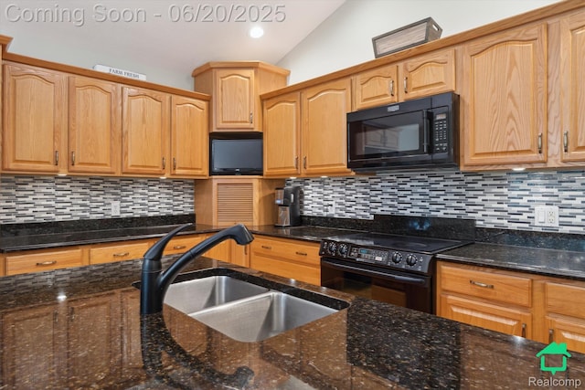 4273 Fairway Ln, Jackson, MI 49201 - kitchen with black appliances, dark stone countertops, backsplash, and lofted ceiling
