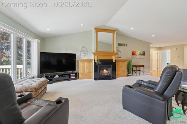 4273 Fairway Ln, Jackson, MI 49201 - living area with vaulted ceiling, a fireplace with flush hearth, light carpet, and recessed lighting