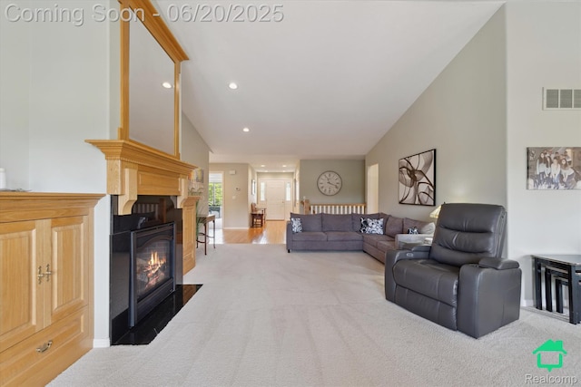 4273 Fairway Ln, Jackson, MI 49201 - living room featuring carpet flooring, a glass covered fireplace, recessed lighting, and high vaulted ceiling