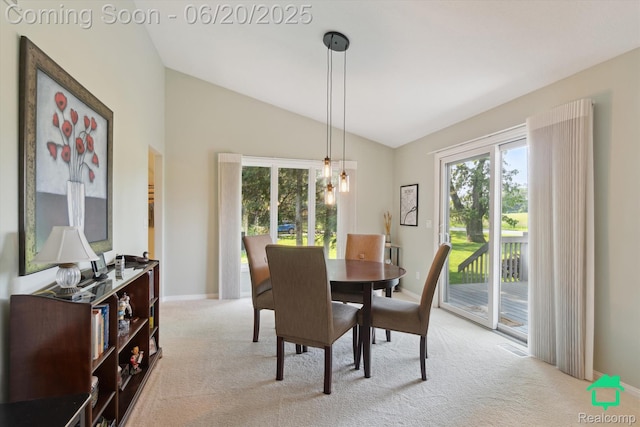 4273 Fairway Ln, Jackson, MI 49201 - dining area featuring vaulted ceiling and light carpet
