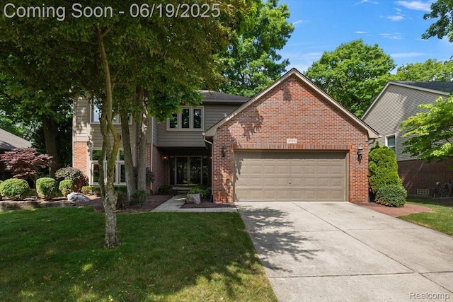2082 Avon Lake Ln, Rochester Hills, MI 48307 - view of front of home with brick siding, a garage, driveway, and a front yard