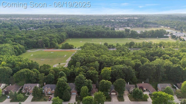 2082 Avon Lake Ln, Rochester Hills, MI 48307 - aerial view of property and surrounding area with nearby suburban area and a forest