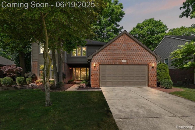 2082 Avon Lake Ln, Rochester Hills, MI 48307 - view of front of house featuring brick siding, a garage, a front lawn, and concrete driveway
