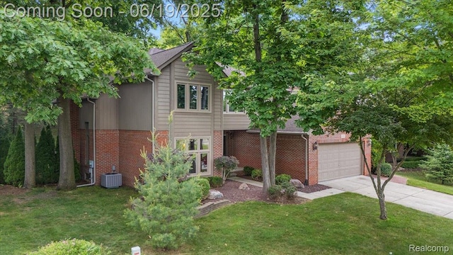 2082 Avon Lake Ln, Rochester Hills, MI 48307 - traditional home with a front yard, concrete driveway, brick siding, and an attached garage