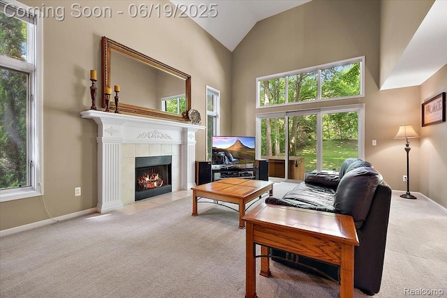 2082 Avon Lake Ln, Rochester Hills, MI 48307 - living area with carpet floors, plenty of natural light, a fireplace, and high vaulted ceiling