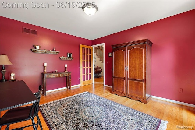 2082 Avon Lake Ln, Rochester Hills, MI 48307 - home office with light wood-type flooring and french doors