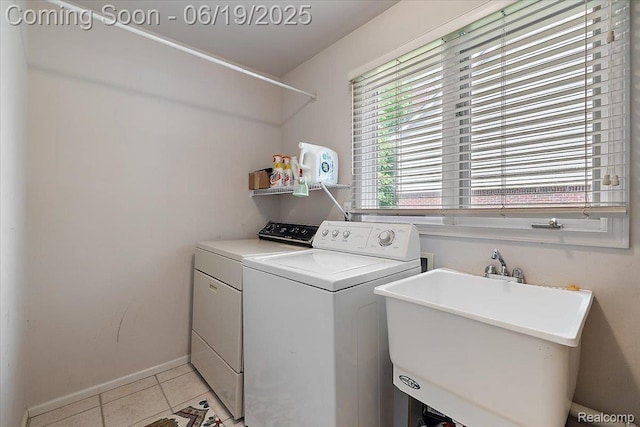 2082 Avon Lake Ln, Rochester Hills, MI 48307 - washroom featuring washing machine and clothes dryer and light tile patterned floors