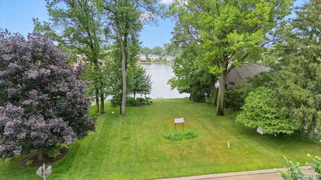 2082 Avon Lake Ln, Rochester Hills, MI 48307 - view of green lawn featuring a water view